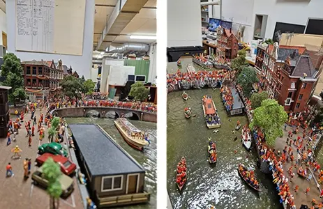 Oranje figuurtjes langs de gracht en op de bruggen
